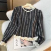 sg-11134201-7rdxn-lza81ck28cj8f7.webp French style Ladies Lace striped long sleeve blouse crewneck single breasted loose version